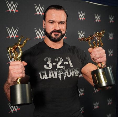 He is holding his award.